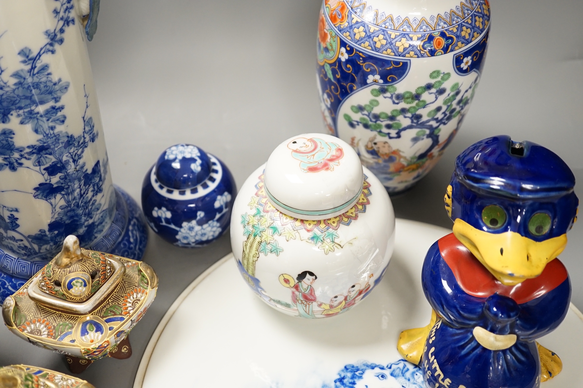A group of 20th century Chinese and Japanese ceramics, including a blue and white circular plaque, 31 cm diameter